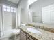 Bathroom with shower/tub combo, granite vanity and a mirror at 10356 Stone Glen Dr, Orlando, FL 32825