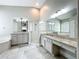 Bathroom with dual sinks, bathtub, glass enclosed shower at 10356 Stone Glen Dr, Orlando, FL 32825