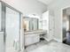 Bathroom with a walk in shower, granite vanity, and tile floors at 10356 Stone Glen Dr, Orlando, FL 32825