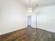 Bedroom with hardwood floors, closet doors, modern light fixture and neutral paint at 10356 Stone Glen Dr, Orlando, FL 32825