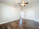 Light and airy bedroom with hardwood flooring, neutral walls, and ample closet space at 10356 Stone Glen Dr, Orlando, FL 32825