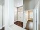 Foyer featuring hardwood floors, with view into a room with a window and neutral walls at 10356 Stone Glen Dr, Orlando, FL 32825