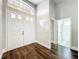 Bright and spacious foyer with high ceilings, featuring beautiful dark hardwood floors at 10356 Stone Glen Dr, Orlando, FL 32825