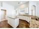 Bright kitchen with white cabinets, granite countertops, and an island, creating a modern and functional space at 10356 Stone Glen Dr, Orlando, FL 32825