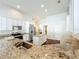 Open kitchen featuring granite countertops, stainless steel appliances, and a center island at 10356 Stone Glen Dr, Orlando, FL 32825