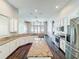 Gourmet kitchen with granite countertops, island, stainless appliances, and hardwood floors at 10356 Stone Glen Dr, Orlando, FL 32825