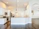 Open kitchen with stainless appliances, granite counters, pendant lighting and a breakfast bar at 10356 Stone Glen Dr, Orlando, FL 32825