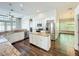 Bright open kitchen featuring stainless steel appliances, an island and granite countertops at 10356 Stone Glen Dr, Orlando, FL 32825