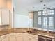Bright kitchen with granite countertops, modern appliances, and an open view to the living room at 10356 Stone Glen Dr, Orlando, FL 32825
