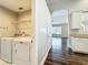 A full laundry room with washer and dryer is located right off the kitchen and living room at 10356 Stone Glen Dr, Orlando, FL 32825
