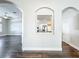 Arched doorways showcase the open floor plan between the living room and kitchen at 10356 Stone Glen Dr, Orlando, FL 32825