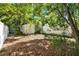 Backyard featuring a white fence and a storage shed at 108 S Glenwood Ave, Orlando, FL 32803