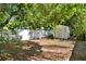 Backyard featuring a white fence and a storage shed at 108 S Glenwood Ave, Orlando, FL 32803
