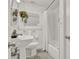 Classic bathroom with a pedestal sink, tiled floor, and shower-tub combination at 108 S Glenwood Ave, Orlando, FL 32803