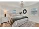 Bright bedroom featuring hardwood floors, stylish decor, and plantation shutters for ample natural light at 108 S Glenwood Ave, Orlando, FL 32803