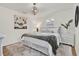 This bright bedroom offers a cozy, inviting space featuring plantation shutters and hardwood flooring at 108 S Glenwood Ave, Orlando, FL 32803