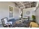 Relaxing covered patio featuring comfortable seating, stylish decor, and an inviting space to unwind and relax at 108 S Glenwood Ave, Orlando, FL 32803