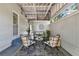 Inviting covered patio featuring comfortable seating, stylish decor, and a relaxing ambiance with natural light at 108 S Glenwood Ave, Orlando, FL 32803
