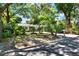A charming single-story home surrounded by lush greenery, landscaping, and mature trees in a quiet neighborhood at 108 S Glenwood Ave, Orlando, FL 32803