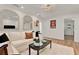 Bright and airy living room featuring a large white couch, fluffy rug, and modern decor at 108 S Glenwood Ave, Orlando, FL 32803