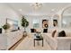 Bright and airy living room featuring a large white couch, fluffy rug, and modern decor at 108 S Glenwood Ave, Orlando, FL 32803