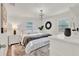 Bright main bedroom featuring a plush bed, modern lighting, and ample natural light at 108 S Glenwood Ave, Orlando, FL 32803