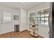 Bright pantry with wood floors, storage cabinet, stainless steel trash can, and gold bar cart near window at 108 S Glenwood Ave, Orlando, FL 32803