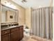 Full bathroom with patterned walls, a stylish vanity, and a shower with patterned curtain at 1112 Sunset View Cir # 302, Reunion, FL 34747