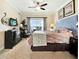 Elegant bedroom with a queen-sized bed, balcony access, and stylish decor at 1112 Sunset View Cir # 302, Reunion, FL 34747