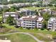 Stunning multi-story condo building boasts golf course views and private balconies perfect for enjoying the outdoors at 1112 Sunset View Cir # 302, Reunion, FL 34747