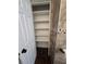 Bathroom shelves next to a decorative tile wall and wood-look tile floors at 1125 W 8Th St, Lakeland, FL 33805