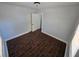 Comfortable bedroom with neutral walls, dark floors, and closet at 1125 W 8Th St, Lakeland, FL 33805