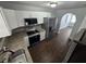 Bright kitchen with stainless steel appliances, granite countertops, and tile flooring at 1125 W 8Th St, Lakeland, FL 33805