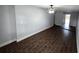 The living room features tile flooring and a ceiling fan for added comfort at 1125 W 8Th St, Lakeland, FL 33805
