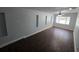 Bright living room with recessed wall features and dark-toned floors at 1125 W 8Th St, Lakeland, FL 33805