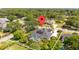 Captivating aerial view showcases the property's pool, solar panels, and serene surroundings at 11401 Willow Stowe Ln, Windermere, FL 34786