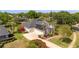 Beautiful home with solar panels on the roof, a well-kept lawn, and mature trees at 11401 Willow Stowe Ln, Windermere, FL 34786