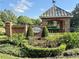Attractive community entrance featuring a brick structure, well-maintained landscaping, and a welcoming sign at 11401 Willow Stowe Ln, Windermere, FL 34786