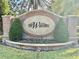 Elegant brick community entrance sign surrounded by lush landscaping welcomes residents and guests at 11401 Willow Stowe Ln, Windermere, FL 34786