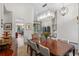 Formal dining room with elegant chandelier and a view to the kitchen and living area at 11401 Willow Stowe Ln, Windermere, FL 34786