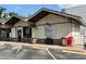 Charming exterior view of Tim's Wine Market featuring ample parking and outdoor seating area at 11401 Willow Stowe Ln, Windermere, FL 34786