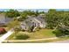Charming home with lush landscaping, a well-manicured lawn, and a welcoming entrance at 11401 Willow Stowe Ln, Windermere, FL 34786
