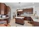 Well-appointed kitchen with center island, stainless steel appliances, and tile backsplash at 11401 Willow Stowe Ln, Windermere, FL 34786