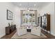 Inviting living room with natural light, stylish furnishings, and a view of the pool area at 11401 Willow Stowe Ln, Windermere, FL 34786