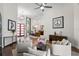Inviting living room with an open layout showcasing modern furniture and access to the dining area at 11401 Willow Stowe Ln, Windermere, FL 34786