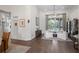 Well-lit living room featuring hardwood floors, neutral decor, and a tranquil ambiance at 11401 Willow Stowe Ln, Windermere, FL 34786