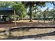 Inviting community playground with slides, swings, and seesaw for recreation at 11401 Willow Stowe Ln, Windermere, FL 34786