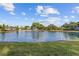 Scenic pond with a fountain, surrounded by lush landscaping, provides a serene community view at 11401 Willow Stowe Ln, Windermere, FL 34786