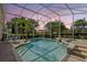 Inviting pool and spa with a screened-in enclosure, providing a private and serene atmosphere at 11401 Willow Stowe Ln, Windermere, FL 34786