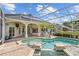 Relaxing screened-in pool area with patio seating and lush landscaping, perfect for outdoor living at 11401 Willow Stowe Ln, Windermere, FL 34786